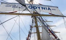 The Dar Młodzieży entering Boston Harbour with cadets on the yards and the Gdynia centenary sail. A. Dopke
